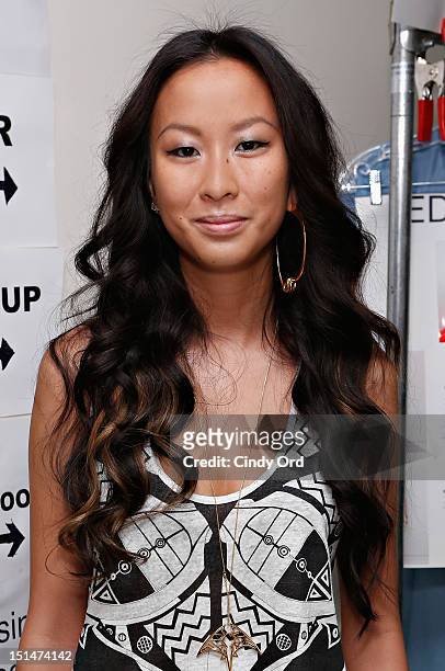 Designer Jen Kao poses backstage at the Jen Kao Spring 2013 fashion show during Mercedes-Fashion Week at the New York Public Library - Celeste Bartos...