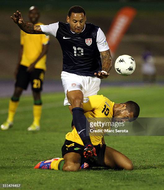 Jermaine Jones of the United States battles for the ball with Omar Cummings of Jamaica during the United States and Jamaica World Cup Qualifier at...