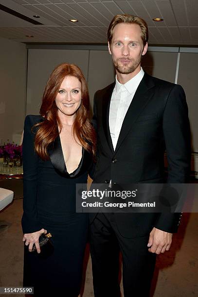 Actors Julianne Moore and Alexander Skarsgård attends "What Maisie Knew" premiere during the 2012 Toronto International Film Festival at Roy Thomson...