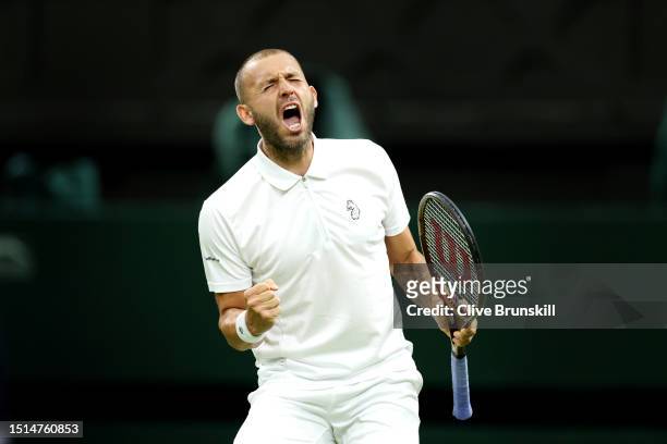 Daniel Evans of Great Britain celebrates after winning the third set against Quentin Halys of France in the Men's Singles first round match during...