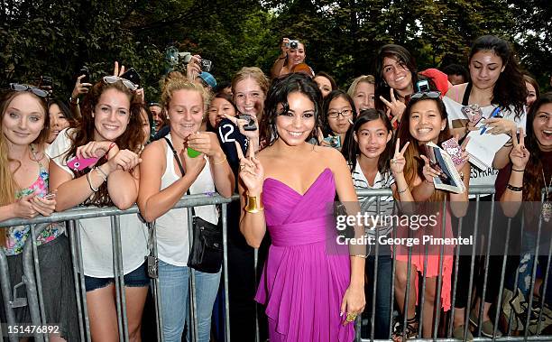 Actress Vanessa Hudgens poses with fans at the "Spring Breakers" premiere during the 2012 Toronto International Film Festival at Ryerson Theatre on...