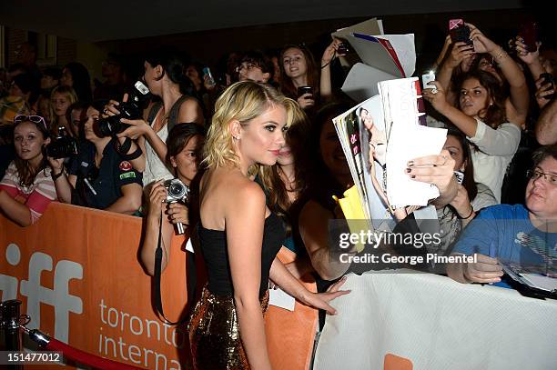 Actress Ashley Benson poses with fans at the "Spring Breakers" premiere during the 2012 Toronto International Film Festival at Ryerson Theatre on...