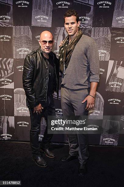 Designer John Varvatos and Brooklyn Nets basketball player Kris Humphries attend the Converse Weapon Launch Party at John Varvatos Bowery NYC on...