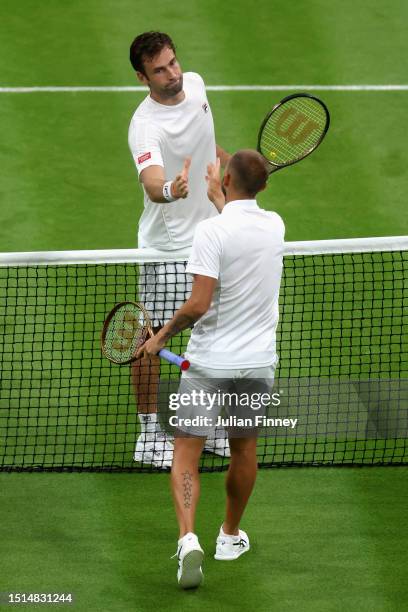 Quentin Halys of France shakes hands with Daniel Evans of Great Britain following the Men's Singles first round match during day two of The...