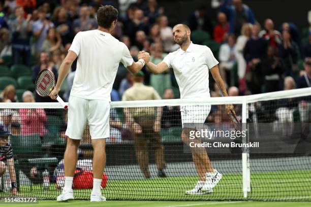 Daniel Evans of Great Britain shakes hands with Quentin Halys of France following the Men's Singles first round match during day two of The...