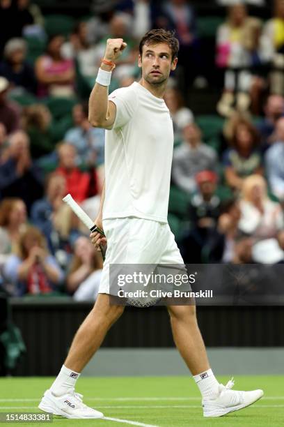 Quentin Halys of France celebrates winning match point against Daniel Evans of Great Britain in the Men's Singles first round match during day two of...