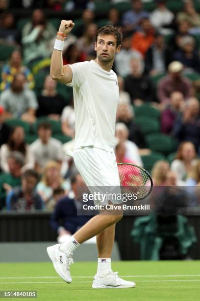 Quentin Halys of France celebrates winning match point against Daniel Evans of Great Britain in the Men's Singles first round match during day two of...