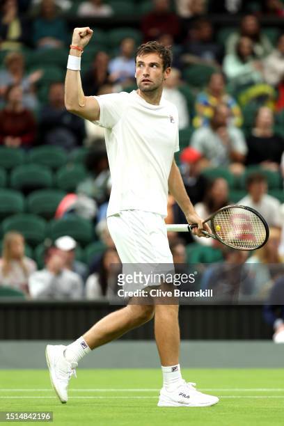 Quentin Halys of France celebrates winning match point against Daniel Evans of Great Britain in the Men's Singles first round match during day two of...
