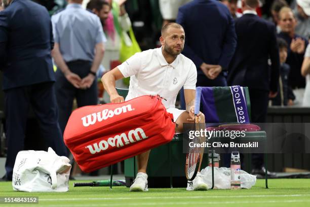 Daniel Evans of Great Britain looks dejected following defeat against Quentin Halys of France in the Men's Singles first round match during day two...