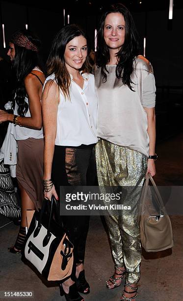 April Hennig of Bergdorf Goodman and Denise Magid of Saks 5th Avenue attend the Helmut Lang spring 2013 fashion show during Mercedes-Benz Fashion...