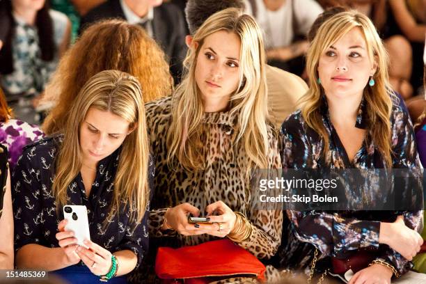 Vogue Style Editor at Large Elisabeth von Thurn und Taxis watches a model on the runway at the Suno spring 2013 fashion show during Mercedes-Benz...
