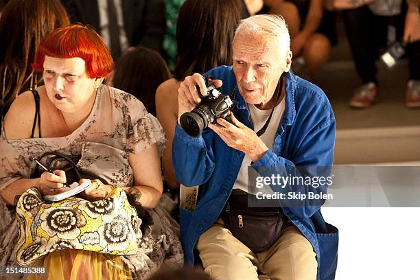 Contributing Fashion Editor for Vogue.com Lynn Yaeger and The New York Times fashion photographer Bill Cunningham watch a model on the runway at the...