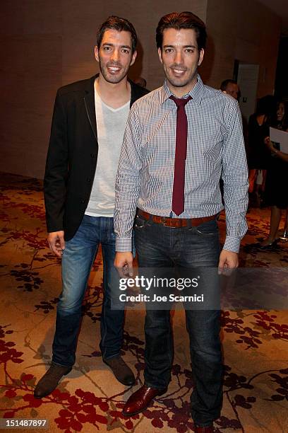 Personalities Jonathan Silver Scott and Drew Scott attend amfAR Cinema Against AIDS TIFF 2012 during the 2012 Toronto International Film Festival at...