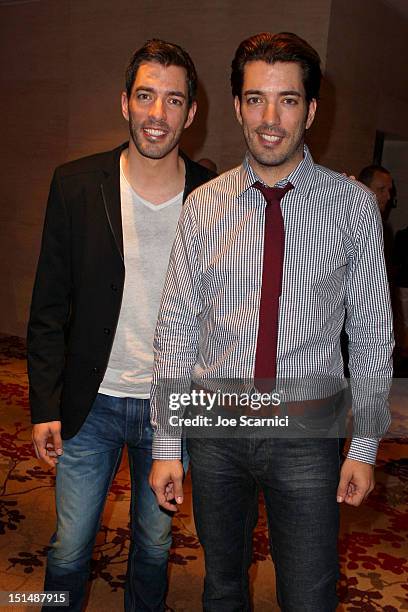 Personalities Jonathan Silver Scott and Drew Scott attend amfAR Cinema Against AIDS TIFF 2012 during the 2012 Toronto International Film Festival at...