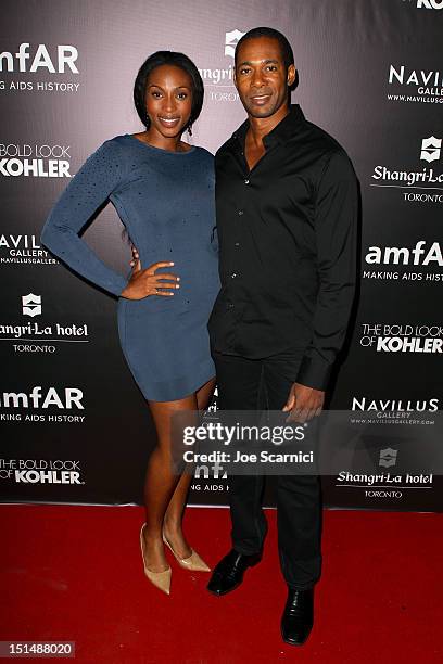 Actors Lisa Berry and Dion Johnstone attend amfAR Cinema Against AIDS TIFF 2012 during the 2012 Toronto International Film Festival at Shangri-La...