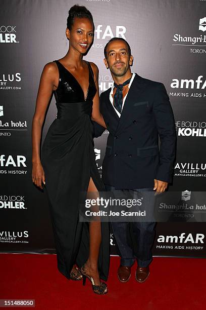 Model Yasmin Warsame and Toufik Sarwa attend amfAR Cinema Against AIDS TIFF 2012 during the 2012 Toronto International Film Festival at Shangri-La...