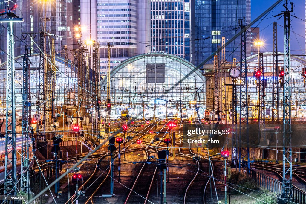Frankfurt/ Main main train station and city skyline at night (Hesse, Germany)