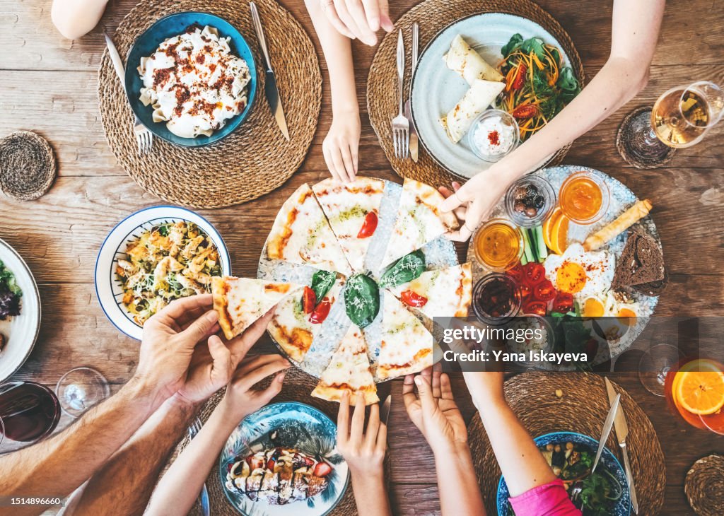 Friends gathering and eating out together