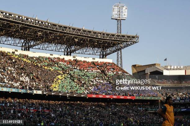 South Africa supporters form a South African flag with coloured panels in the tribunes during the Rugby Championship first round match between South...