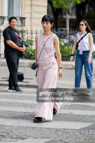 Guest is seen wearing checkered vest, wide leg pants outside Chanel during the Haute Couture Fall/Winter 2023/2024 as part of Paris Fashion Week on...