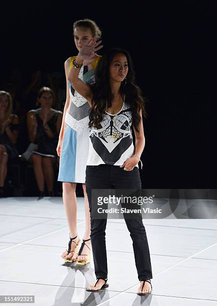 Designer Jen Kao walks the runway at the Jen Kao spring 2013 fashion show during Mercedes-Benz Fashion Week at the New York Public Library - Celeste...