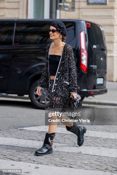 Guest is seen wearing black beret, cardigan, shorts, off shoulder top, b outside Chanel during the Haute Couture Fall/Winter 2023/2024 as part of...