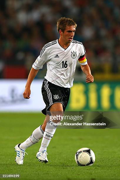 Philipp Lahm of Germany runs with the ball during the FIFA 2014 World Cup Qualifier group C match between Germany and Faeroe Islands at AWD Arena on...