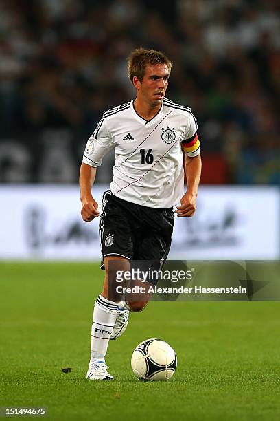 Philipp Lahm of Germany runs with the ball during the FIFA 2014 World Cup Qualifier group C match between Germany and Faeroe Islands at AWD Arena on...