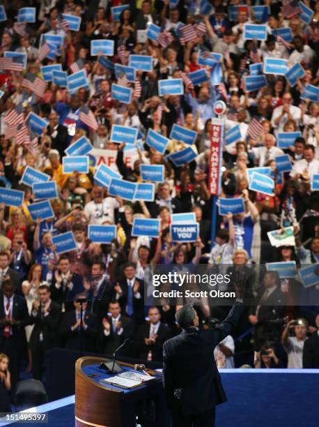 Democratic presidential candidate, U.S. President Barack Obama waves on stage after accepting the nomination during the final day of the Democratic...