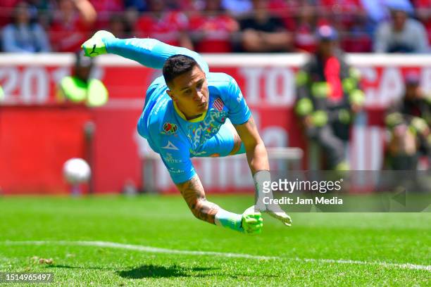 Raul Gudiño goalkeeper of Necaxa dives for the ball during the 1st round match between Toluca and Necaxa as part of the Torneo Apertura 2023 Liga MX...