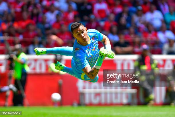 Raul Gudiño goalkeeper of Necaxa dives for the ball during the 1st round match between Toluca and Necaxa as part of the Torneo Apertura 2023 Liga MX...
