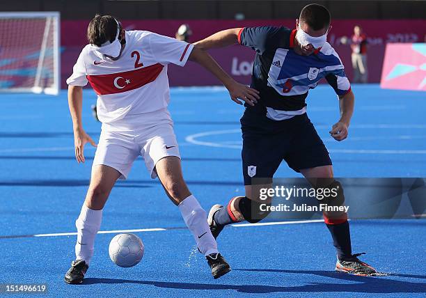 Daniel English of Great Britain and Mikhail Guclu of Turkey battle for the ball in the 7-8 classification match between Great Britain and Turkey...