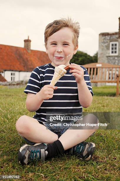 young boy enjoying ice cream - blakeney imagens e fotografias de stock