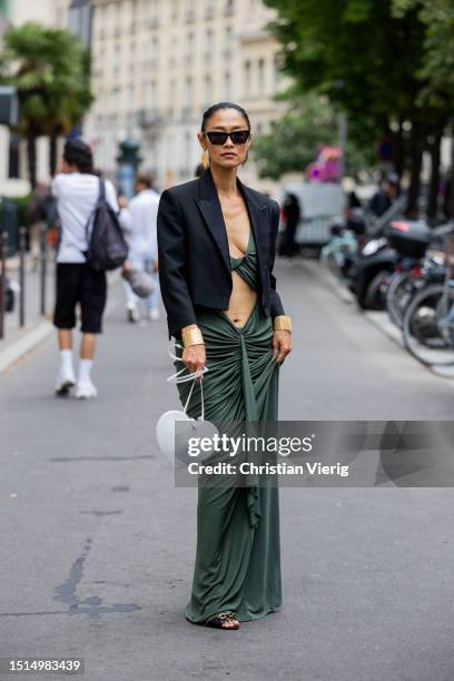 Pornwika Spiecker is seen wearing green cut out dress, Alaia bag, black blazer outside Alexis Mabille during the Haute Couture Fall/Winter 2023/2024...