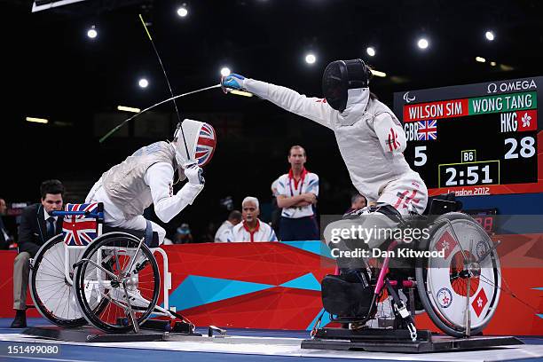 Simon Wilson of Great Britain competes against Tang Tat Wong of Hong Kong, China during the Men's Team Catagory Open Wheelchair Fencing quarter-final...