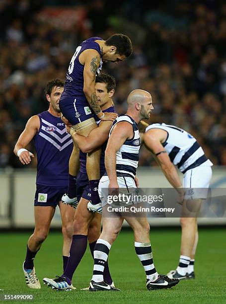 Matthew Pavlich of the Dockers is congratulated by Michael Walters after kicking a goal during the Second AFL Elimination Final match between the...