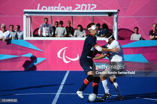 Robin Williams of Great Britain vies for the ball with Ali Cavdar of Turkey during the Men's Team Football 5-a-side - B1 classification match between...