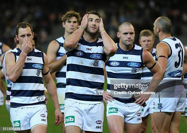 The Cats look dejected as the leave the field after being defeated by the Dockers in the Second AFL Elimination Final match between the Geelong Cats...