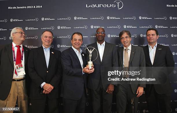 Roberto Jaguaribe , Carlos Nuzman , Sérgio Cabral , Edwin Moses , Luis Fernandez and Guy Saman, pose with a Laureus statuette following the press...