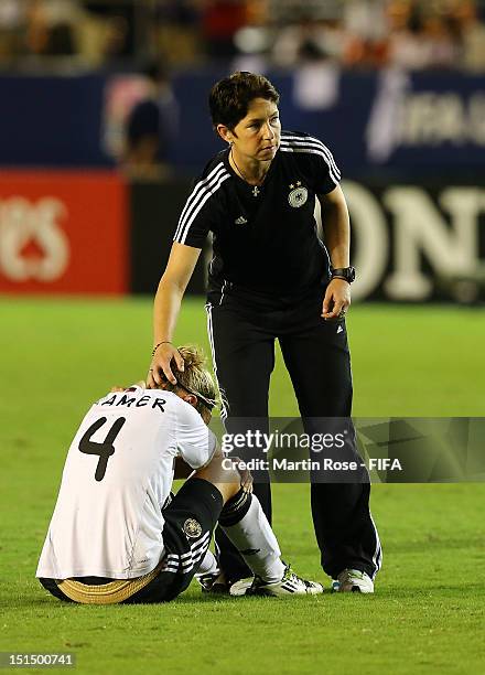 Maren Meinert , head coach of Germany comforts Jennifer Cramer after losing the FIFA U-20 Women's World Cup Japan 2012, Final match between USA and...