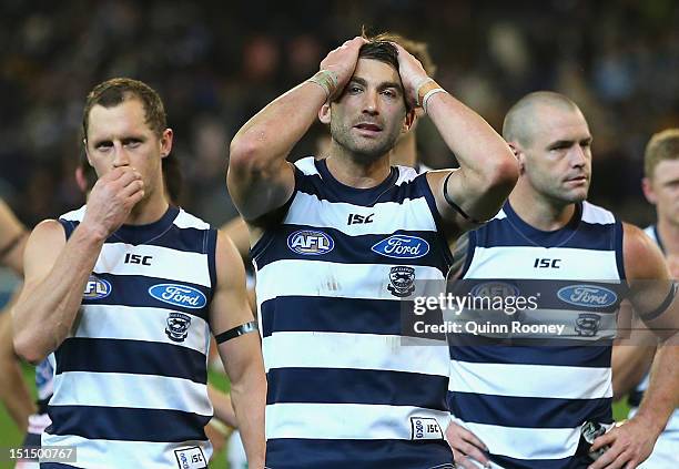 The Cats look dejected as the leave the field after being defeated by the Dockers in the Second AFL Elimination Final match between the Geelong Cats...