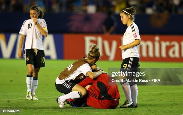 Ramona Petzelberger, Lena Lotzen, Laura Benkarth and Nicole Rolser of Germany look dejected after losing the FIFA U-20 Women's World Cup Japan 2012,...