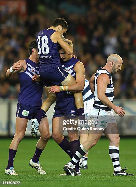 Matthew Pavlich of the Dockers is congratulated by Michael Walters after kicking a goal during the Second AFL Elimination Final match between the...