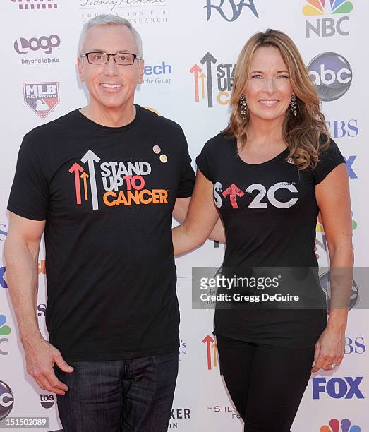 Dr. Drew Pinsky and his wife Susan Pinsky arrive at Stand Up To Cancer at The Shrine Auditorium on September 7, 2012 in Los Angeles, California.