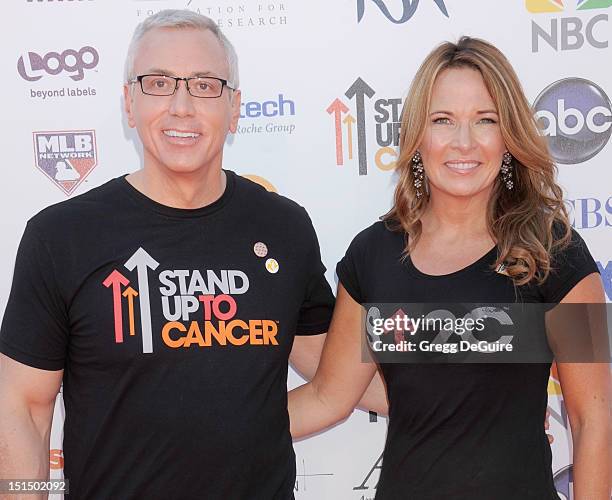 Dr. Drew Pinsky and his wife Susan Pinsky arrive at Stand Up To Cancer at The Shrine Auditorium on September 7, 2012 in Los Angeles, California.