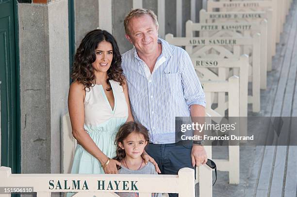 Salma Hayek poses her husband Francois-Henri Pinault with their daughter Valentina Paloma Pinault as she unveiled the beach locker room dedicated to...