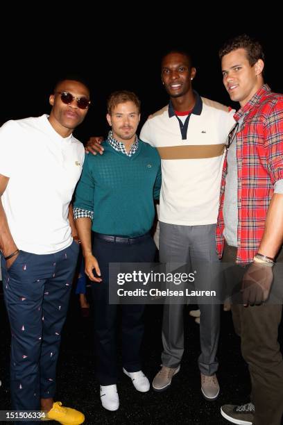 Player Russell Westbrook, actor Kellan Lutz, NBA player Chris Bosh and NBA player Kris Humphries pose backstage at the Lacoste Spring 2013 fashion...