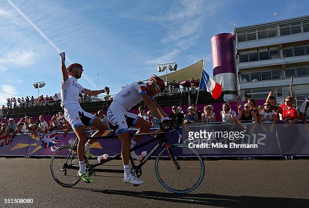 Ivano and Lucca Pizzi of Italy celebrate winning the Men's Individual B Cycling Road Race on day 10 of the London 2012 Paralympic Games at Brands...