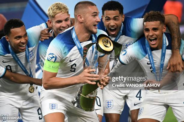 England's players celebrate with the trophy after winning the UEFA European Under-21 Championship final football match between England vs Spain at...