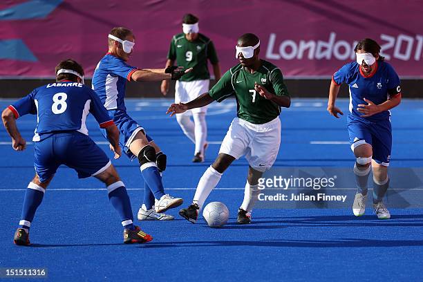 Jeferson da Conceicao Goncalves of Brazil goes past the french midfield in the gold medal match during the 5 a-side Football on day 10 of the London...
